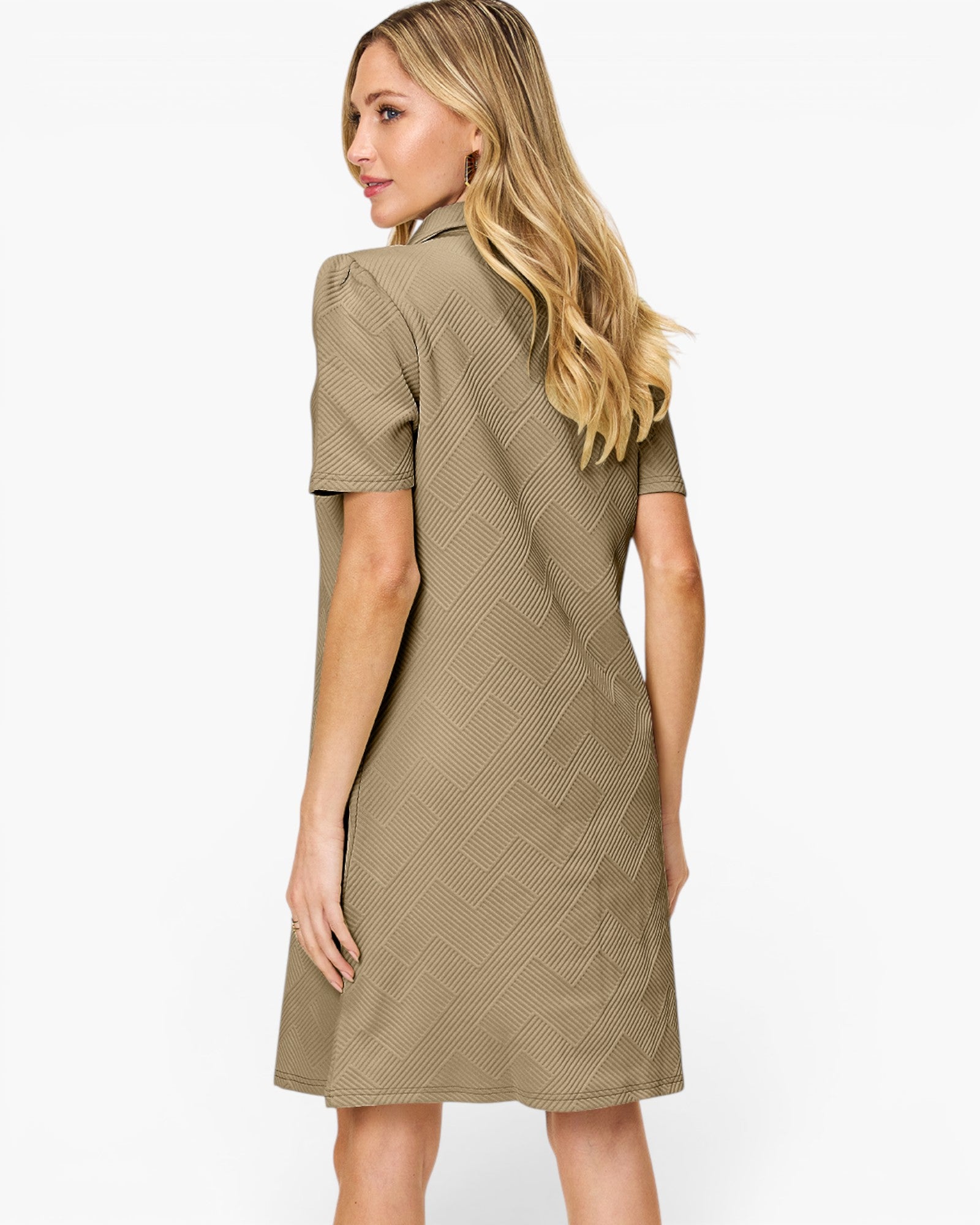 A woman modeling a short-sleeve, knee-length dress from the back, featuring a textured geometric pattern in a warm taupe-brown color, against a plain white background.
