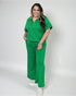Woman wearing a green outfit on a white background