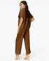 A woman modeling a matching brown two-piece outfit consisting of a short-sleeve cropped top and wide-leg cropped pants, shown from a three-quarters back view against a plain white background.