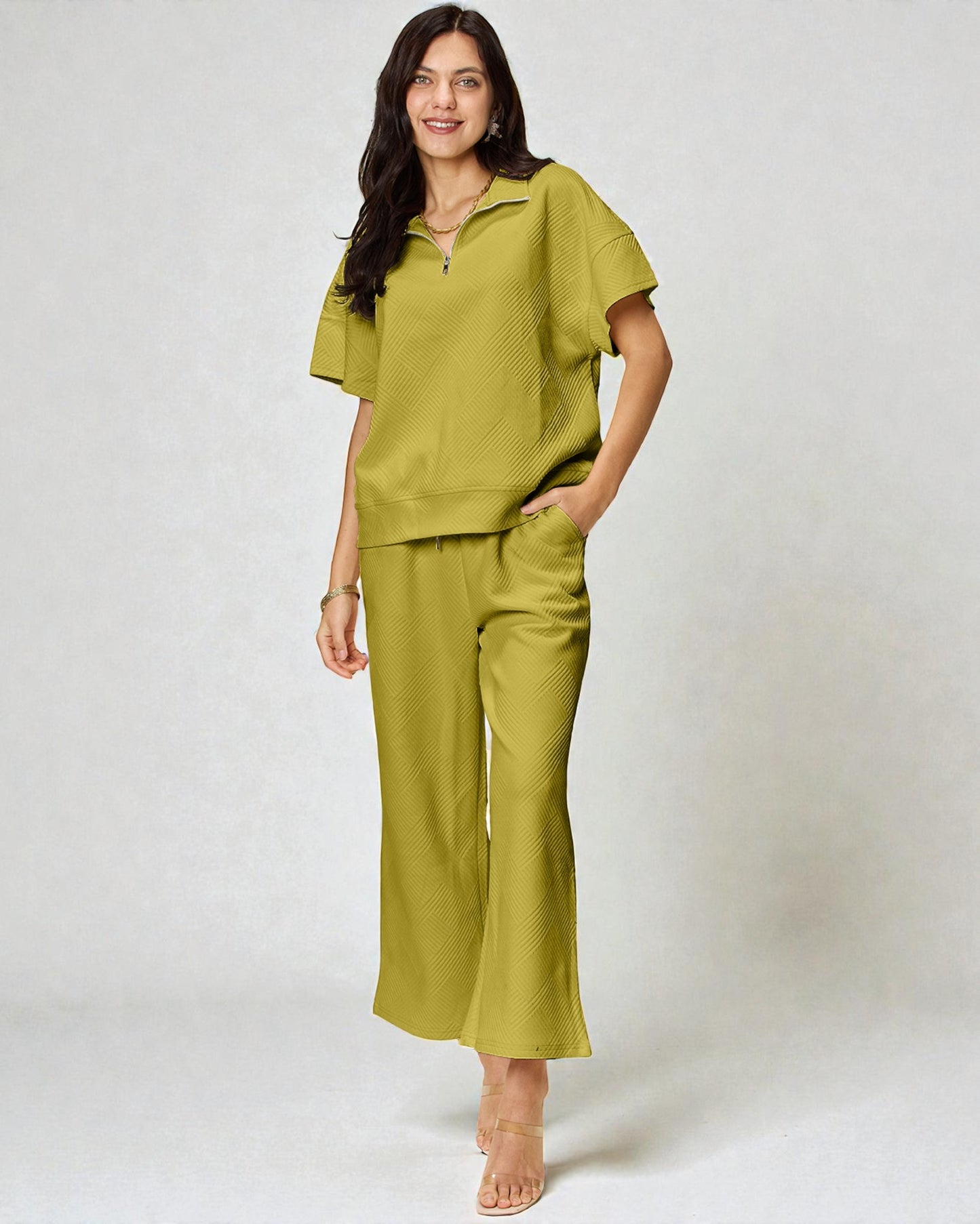 Woman wearing a green outfit on a white background