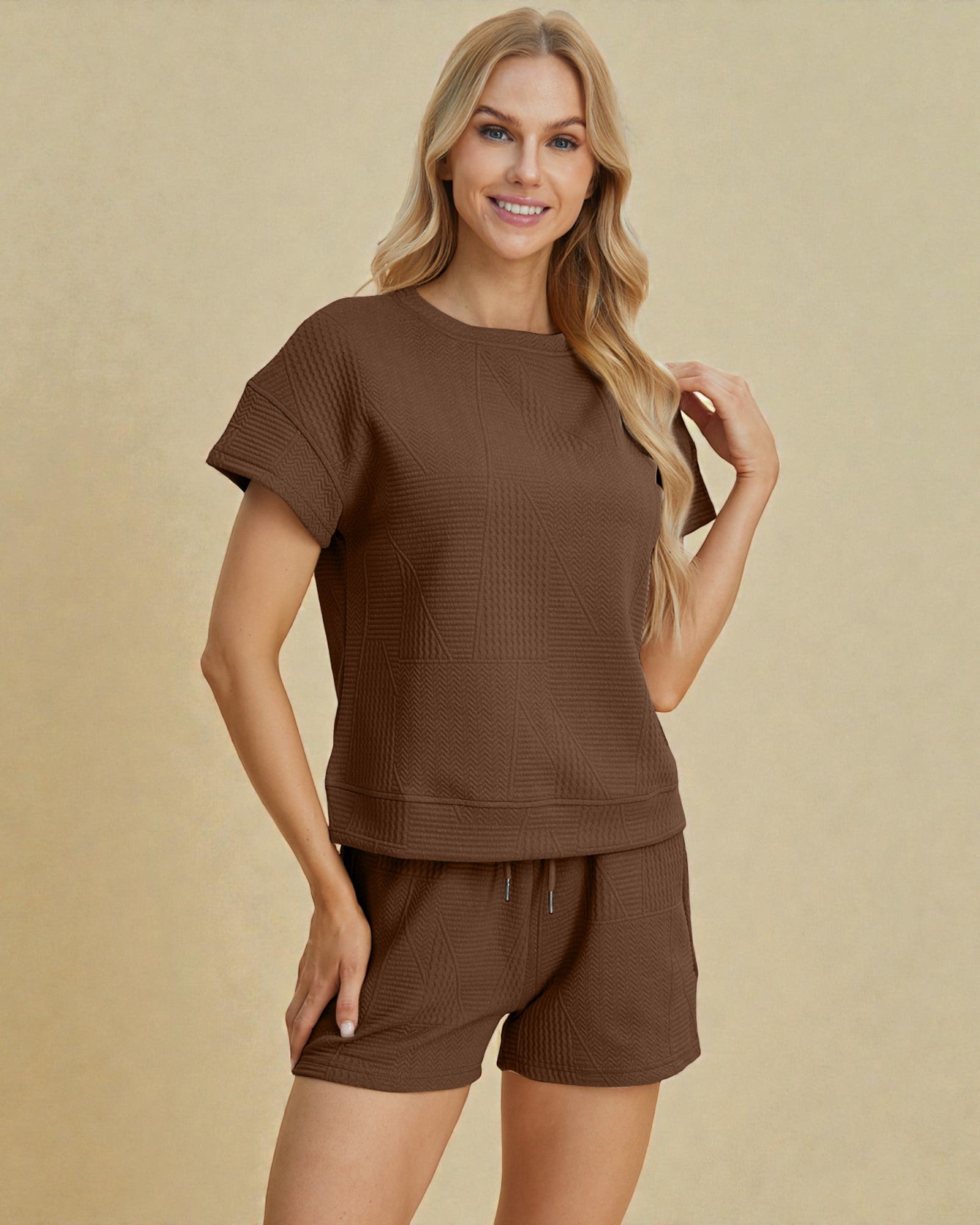 Woman wearing a brown outfit on a beige background