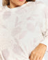 Close-up of a white floral patterned garment