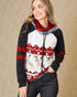 Woman wearing a festive hoodie with reindeer design on a beige background