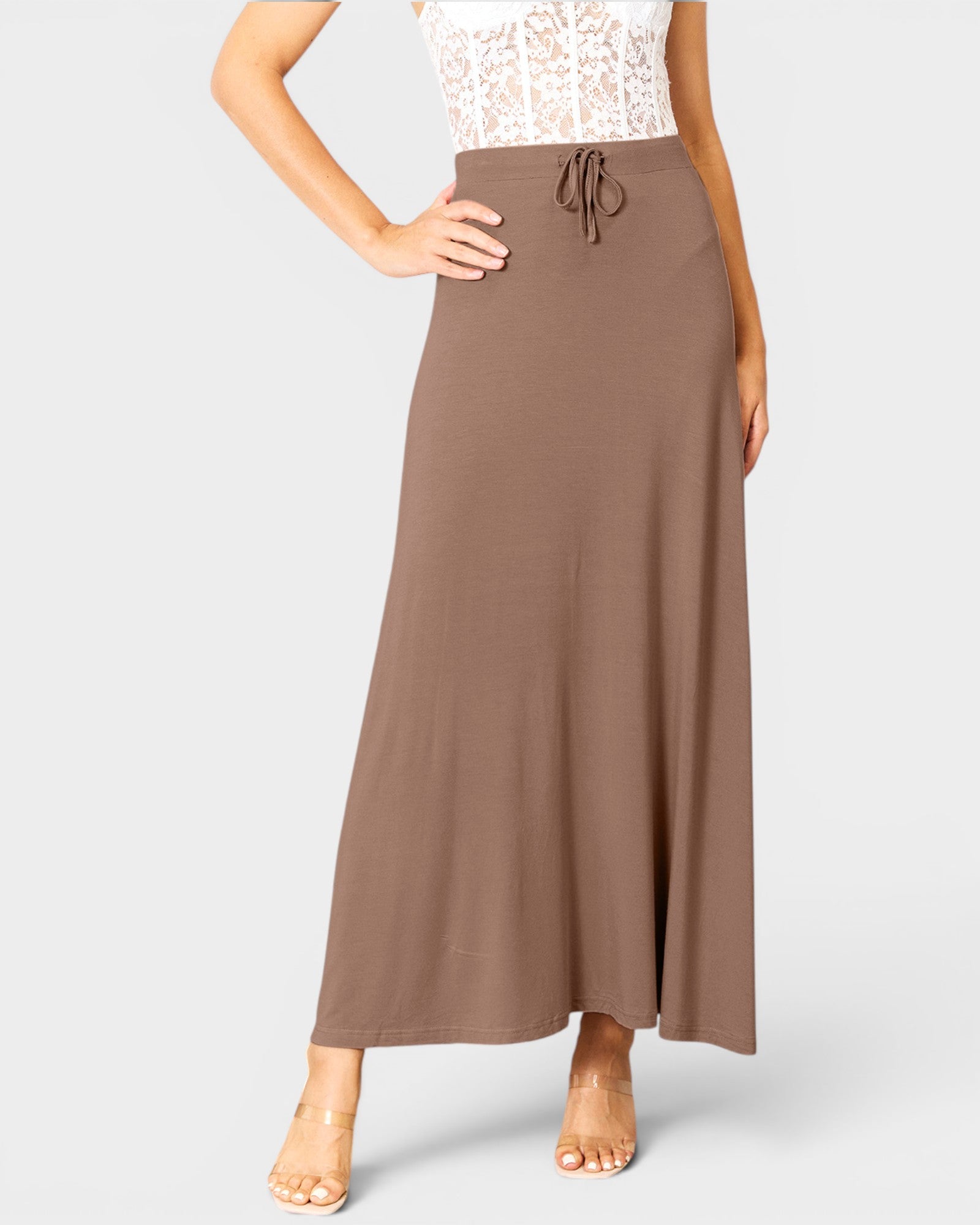 Brown maxi skirt worn by a person on a white background