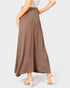 Brown maxi skirt worn by a person on a white background