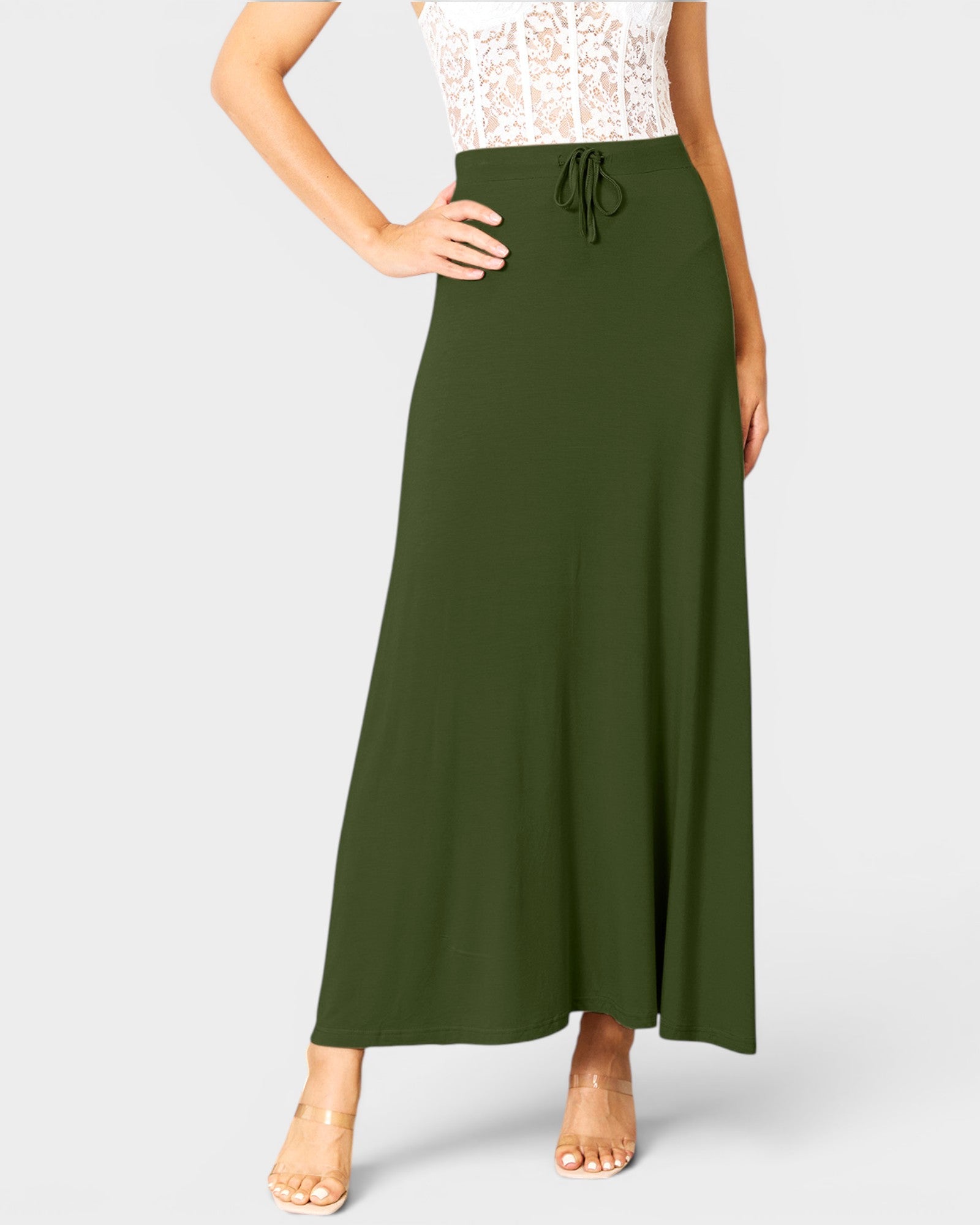 Green maxi skirt worn by a person on a white background
