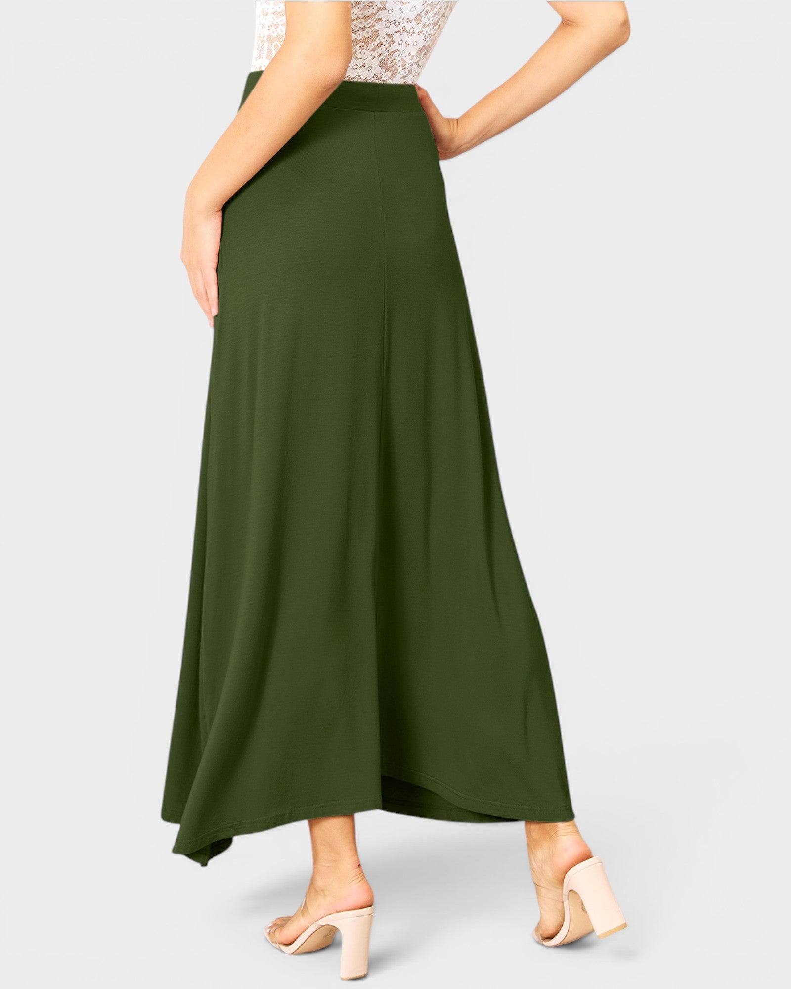 Green skirt worn by a person on a white background
