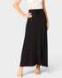 Black skirt worn by a person on a white background