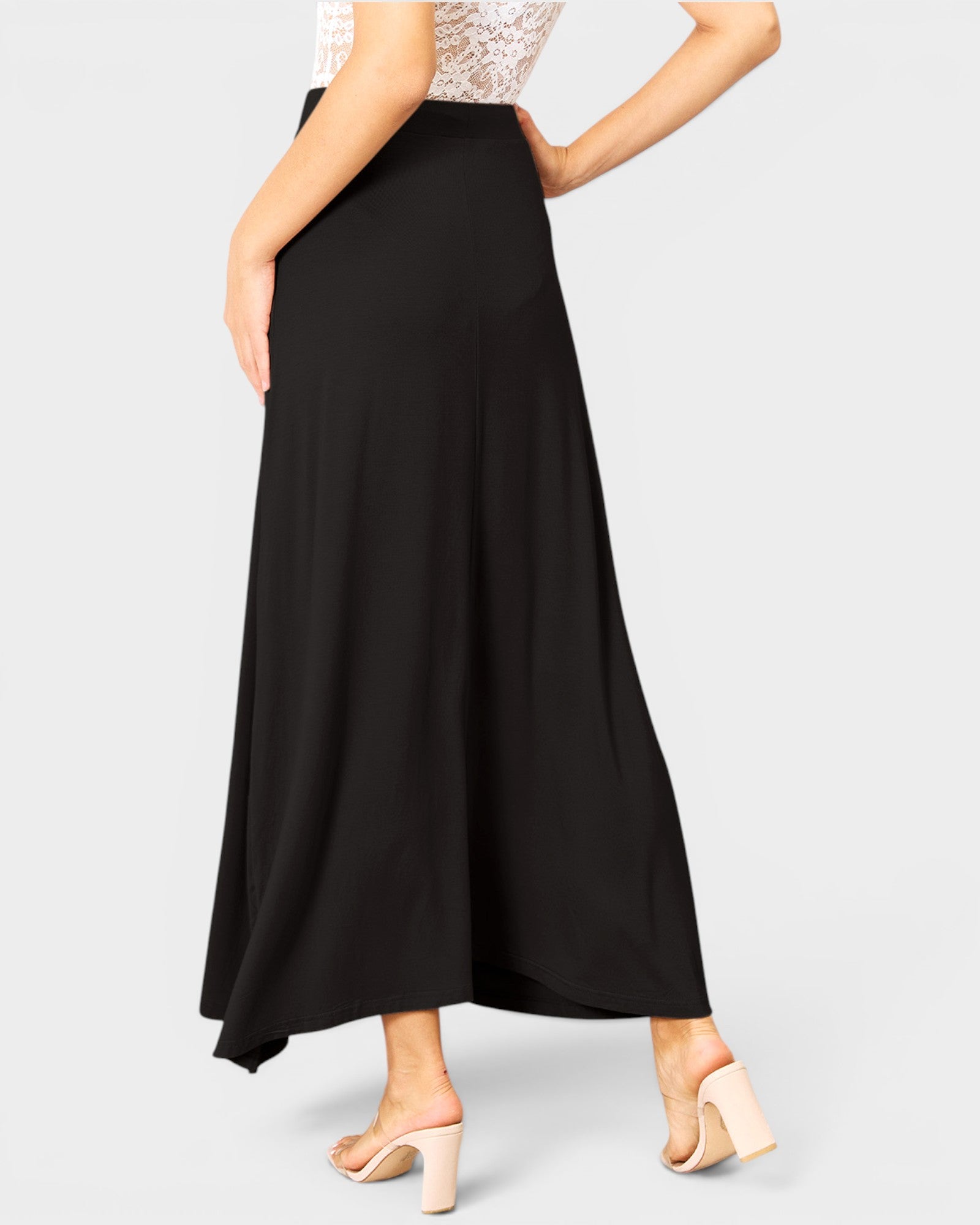Black skirt worn by a person on a white background