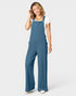 Woman wearing a blue overalls on a white background
