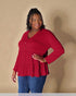 Woman wearing a red blouse with a plain background