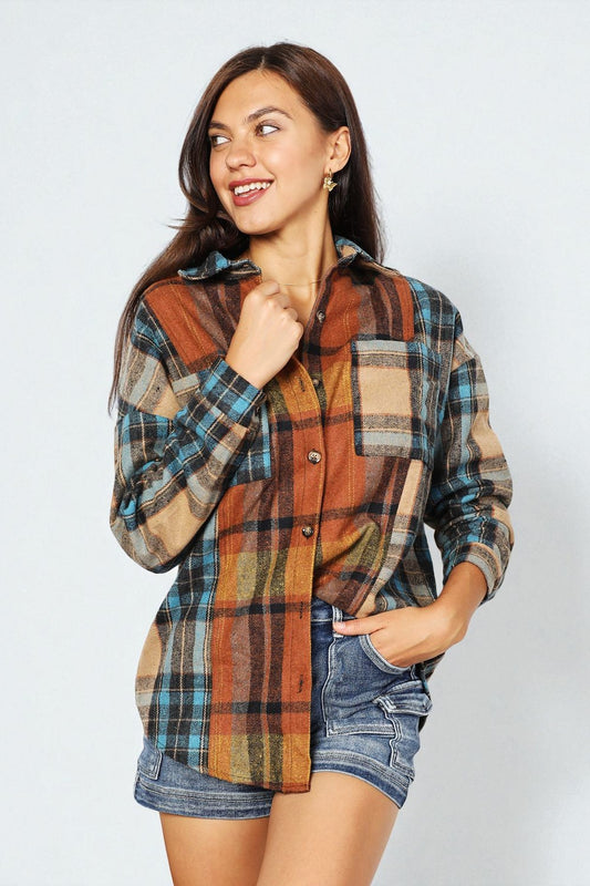 Woman wearing a plaid shirt and denim shorts on a white background