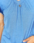 Blue top worn by a person with a heart-shaped pendant necklace.