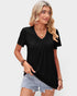 Woman wearing a black V-neck t-shirt and denim shorts on a plain background