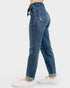 Blue jeans worn by a person on a white background