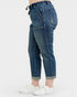 Blue jeans worn by a person on a white background