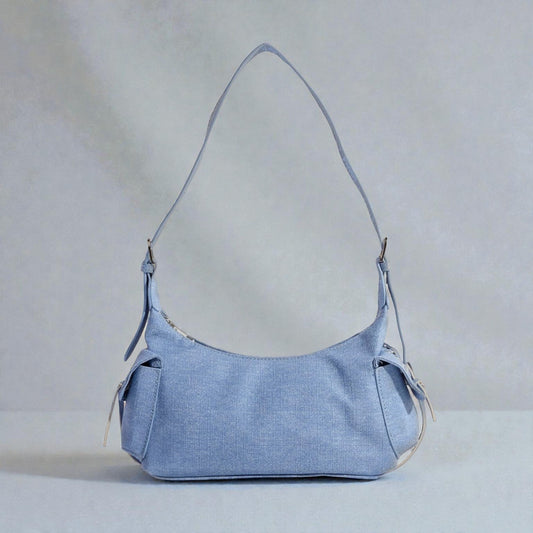 Light blue handbag on a light gray background