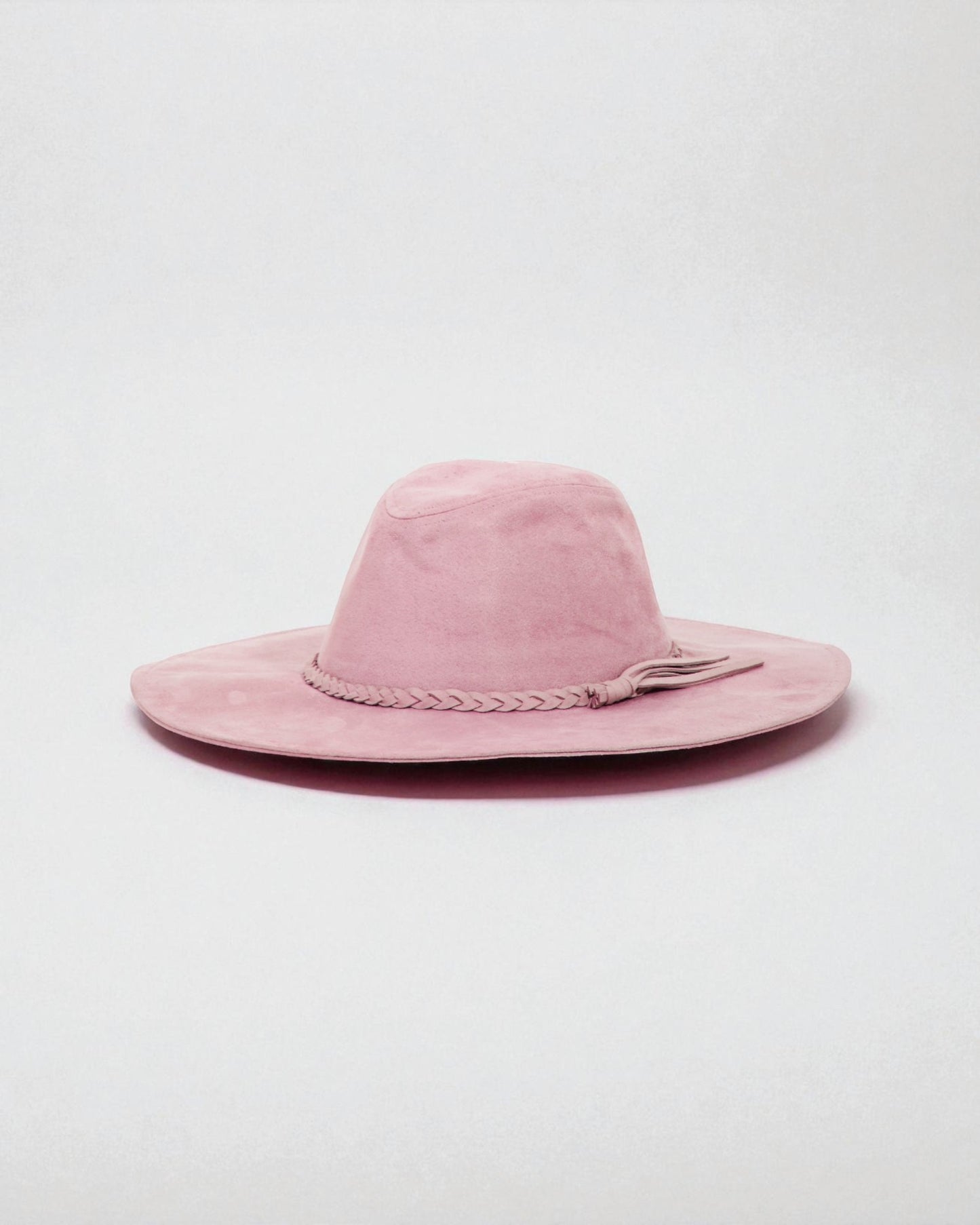 Pink wide-brimmed hat on a light gray background