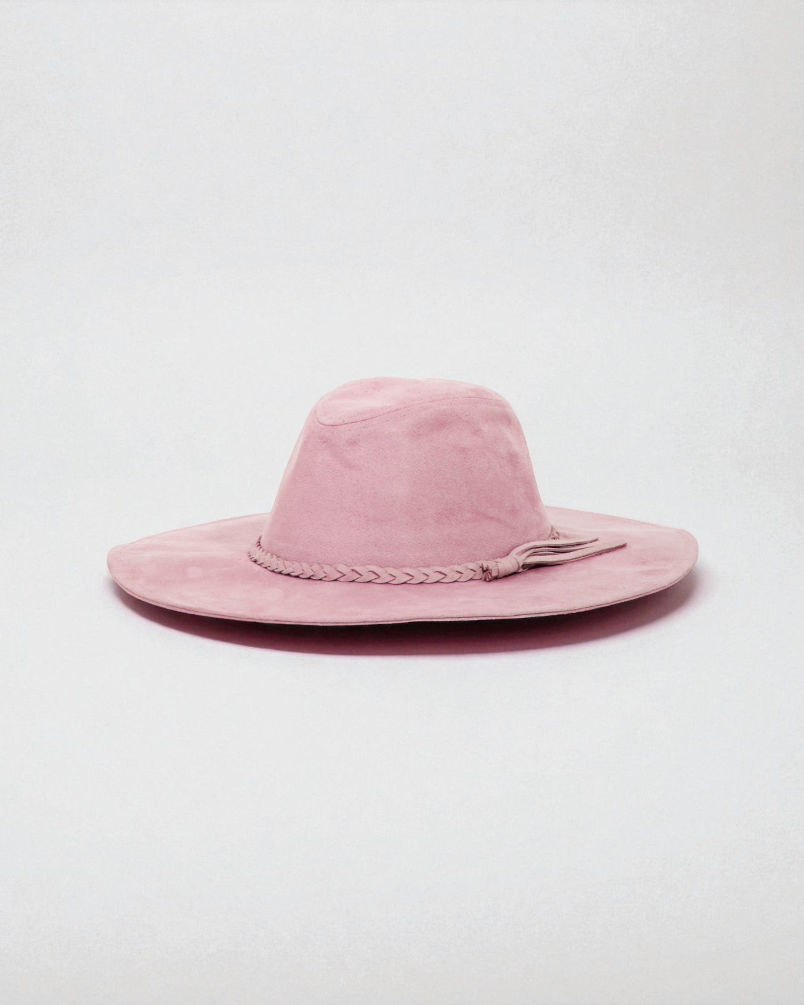 Pink wide-brimmed hat on a light gray background