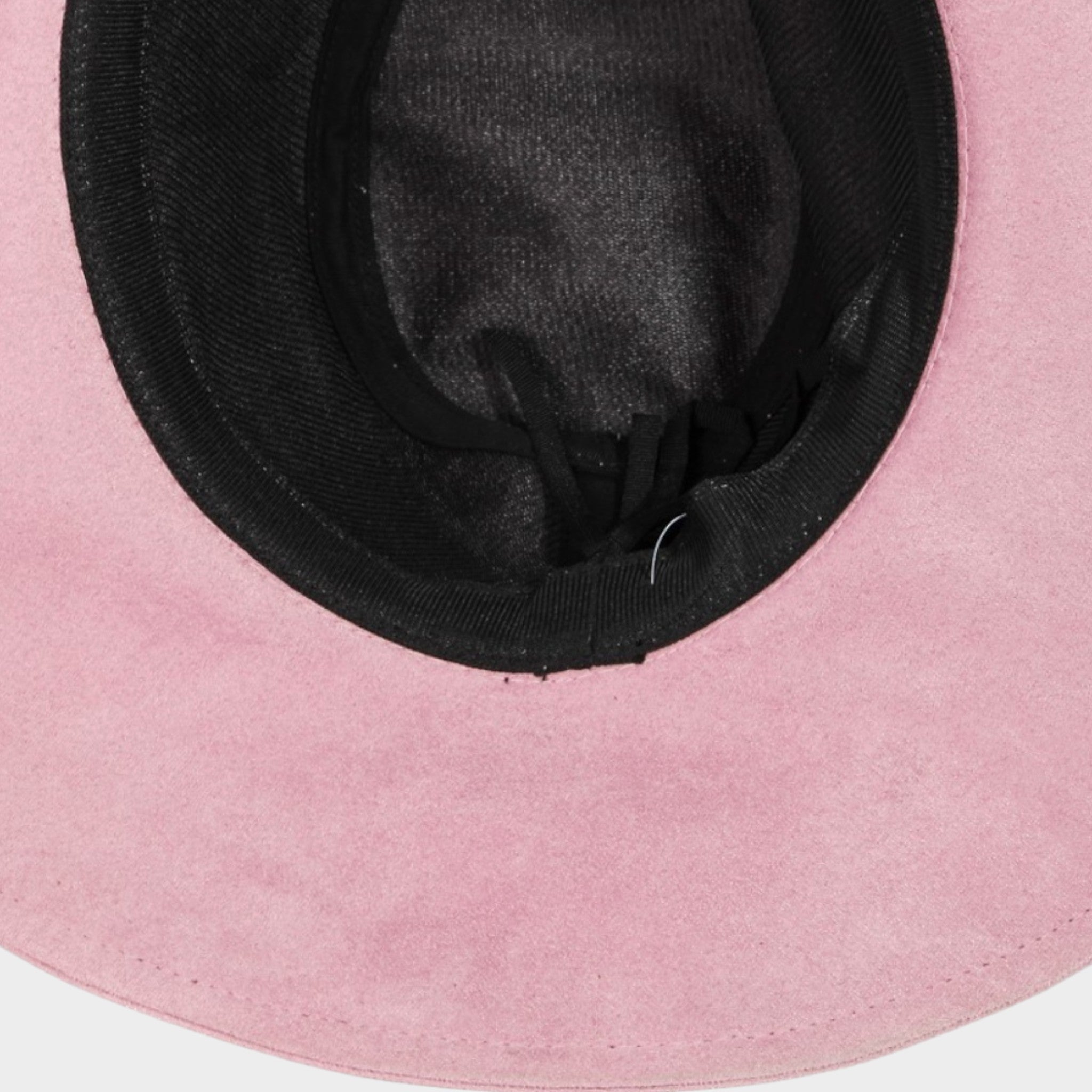 Close-up of a pink hat with a black interior