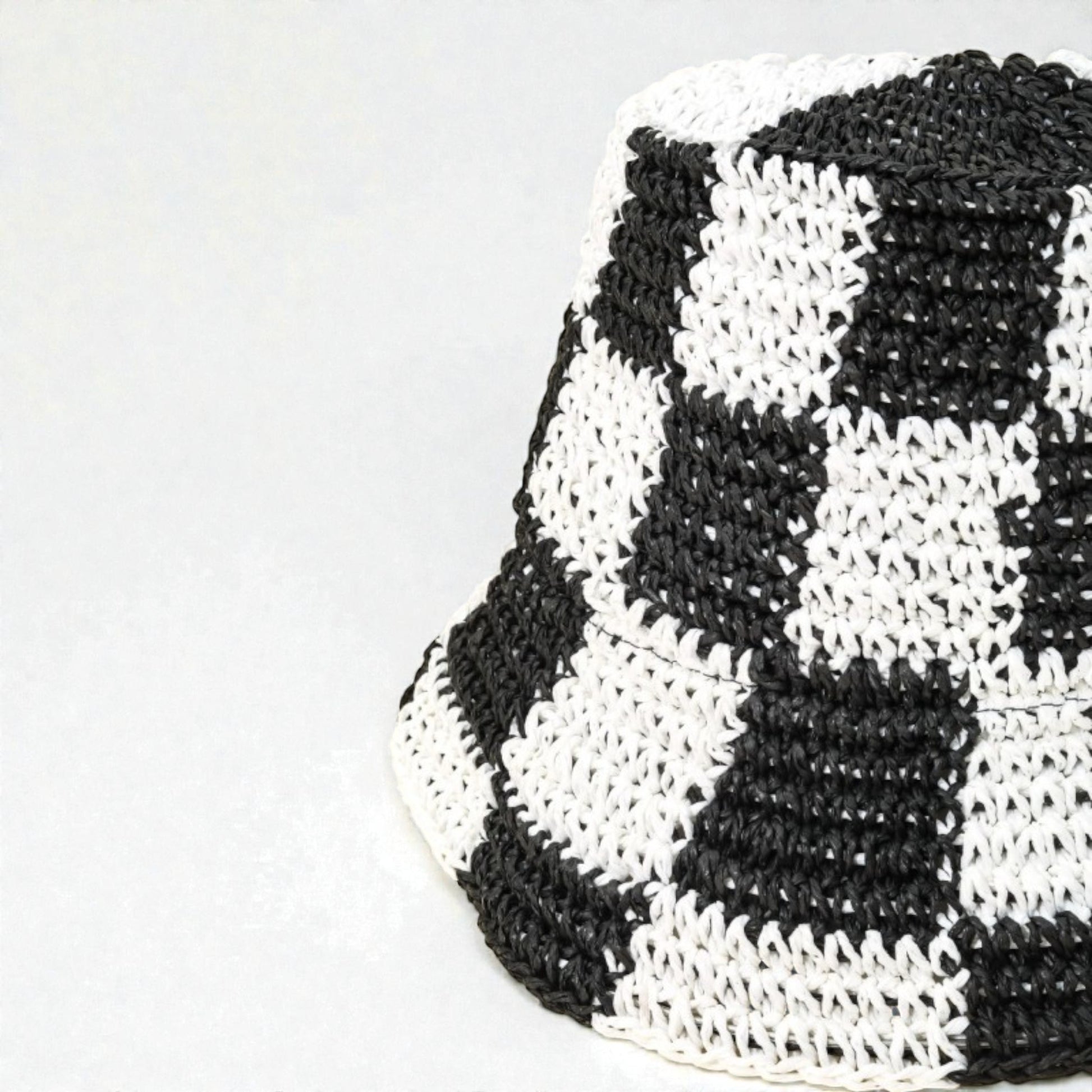 Black and white checkered pattern on a white background