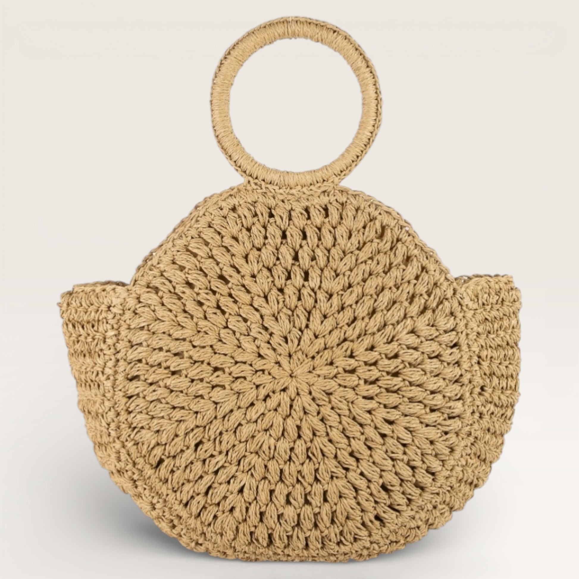 Beige woven handbag with round handles on a light beige background