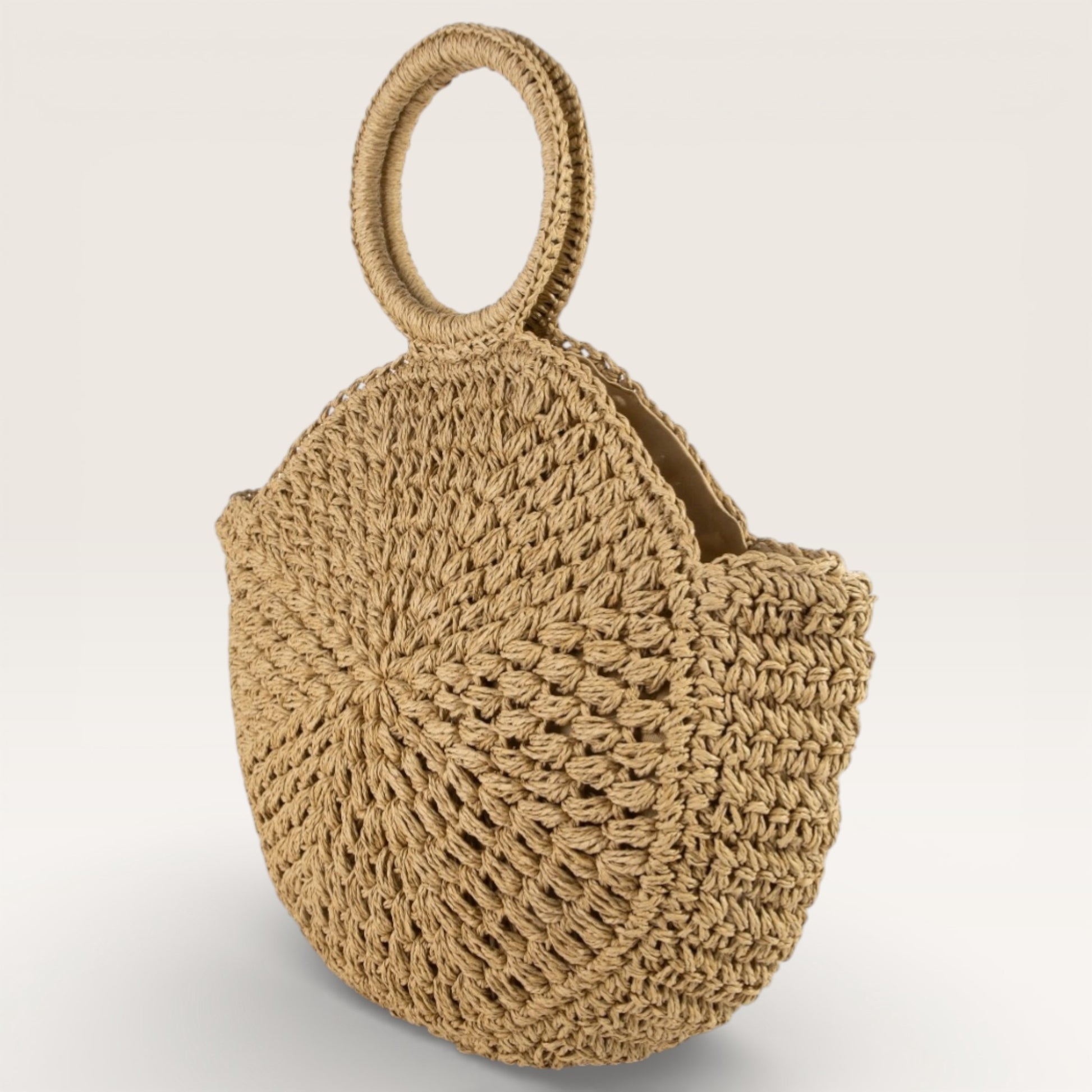 Beige woven handbag on a light gray background