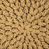 Close-up of a textured beige fabric with a starburst pattern