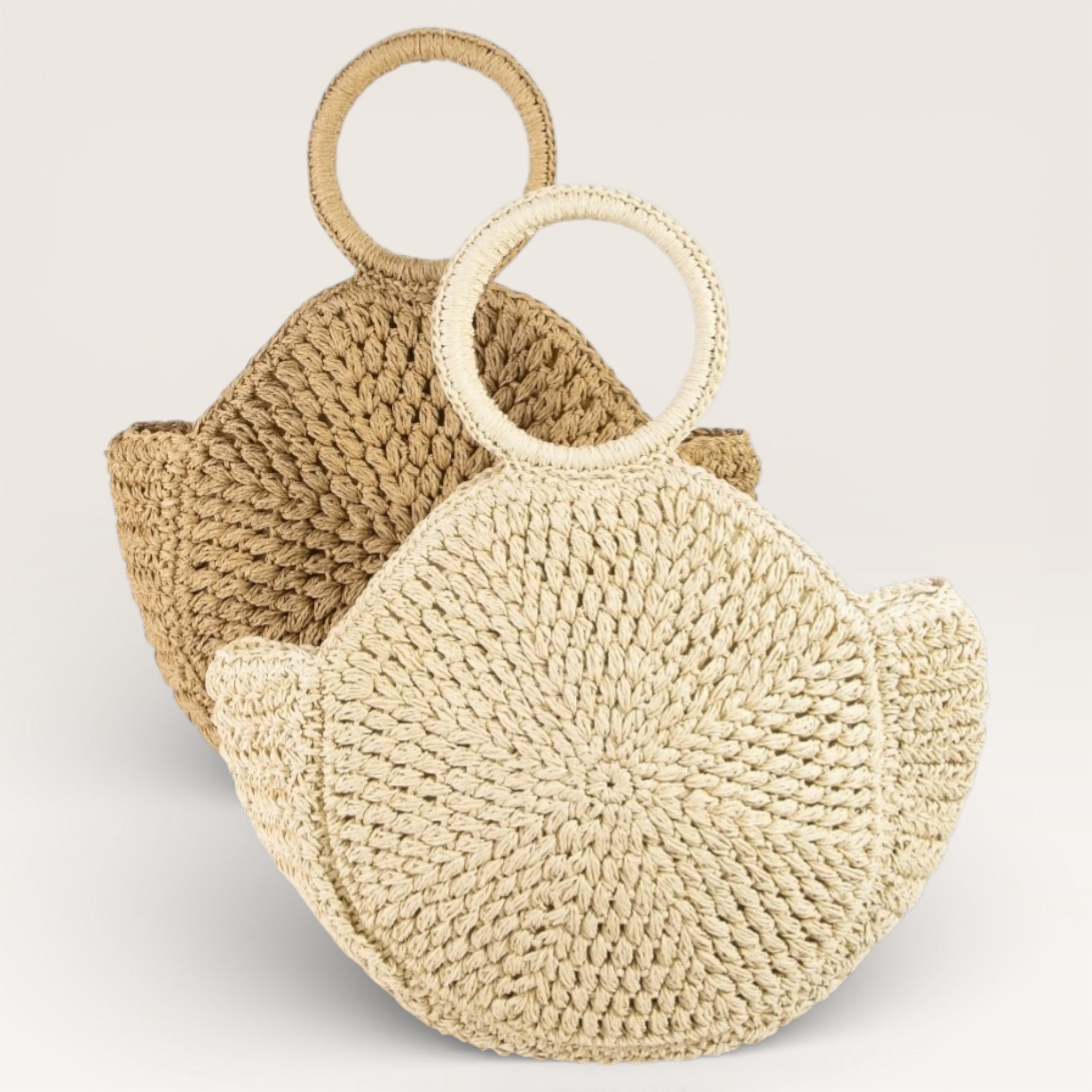 Woven handbag with circular handles on a light gray background