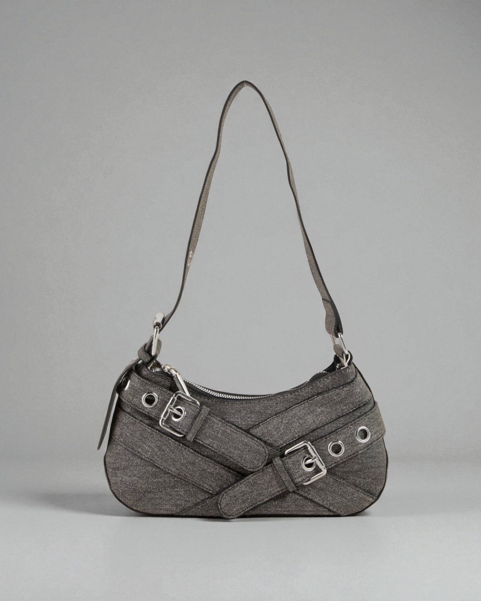 Gray handbag with a strap on a gray background