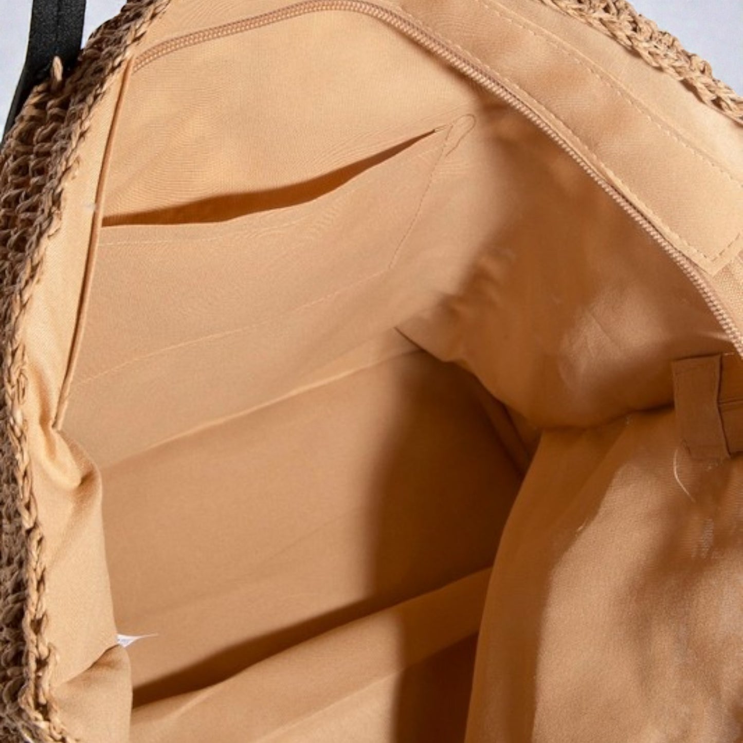 Close-up of a beige backpack with textured surface