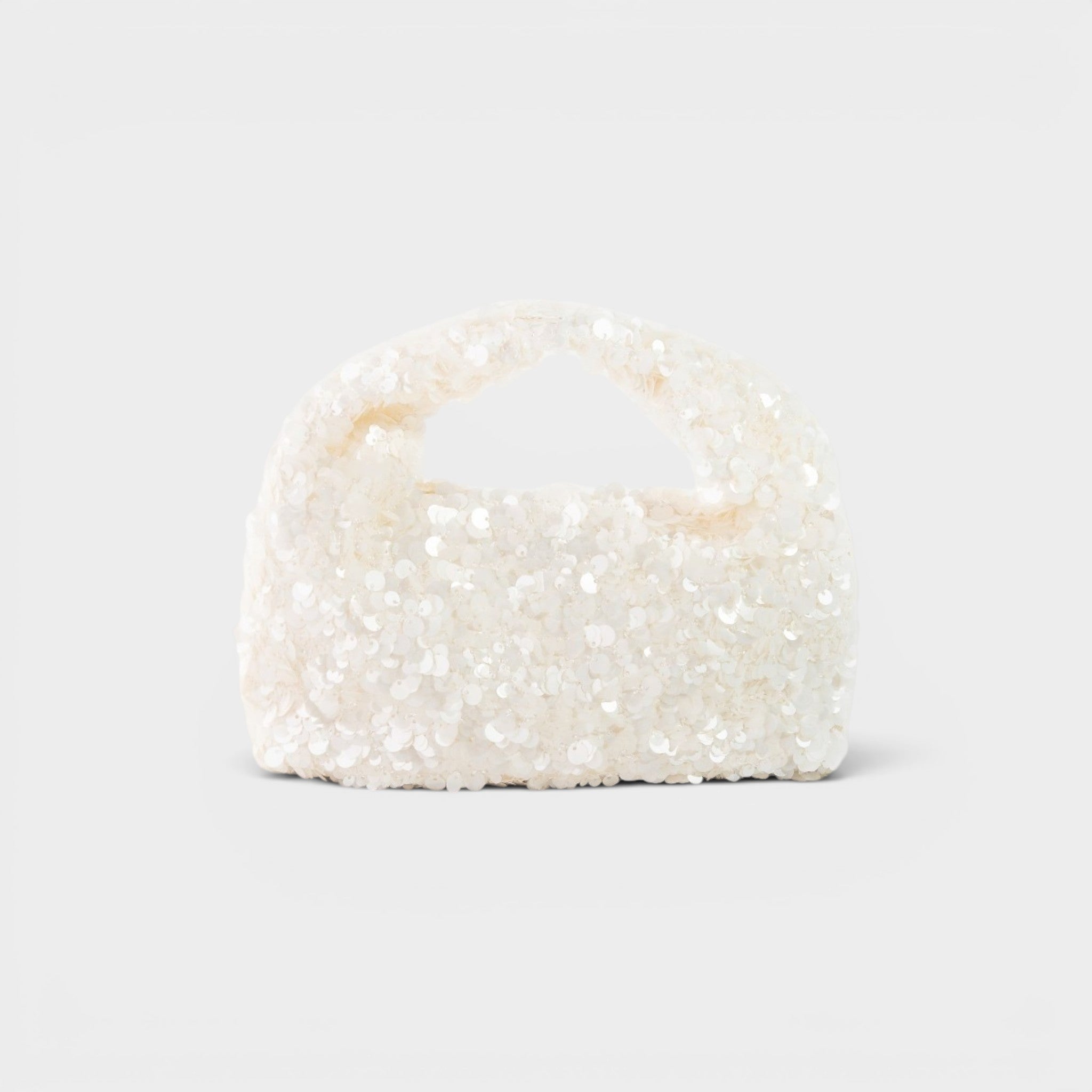 Pearl-handled clutch bag on a light gray background