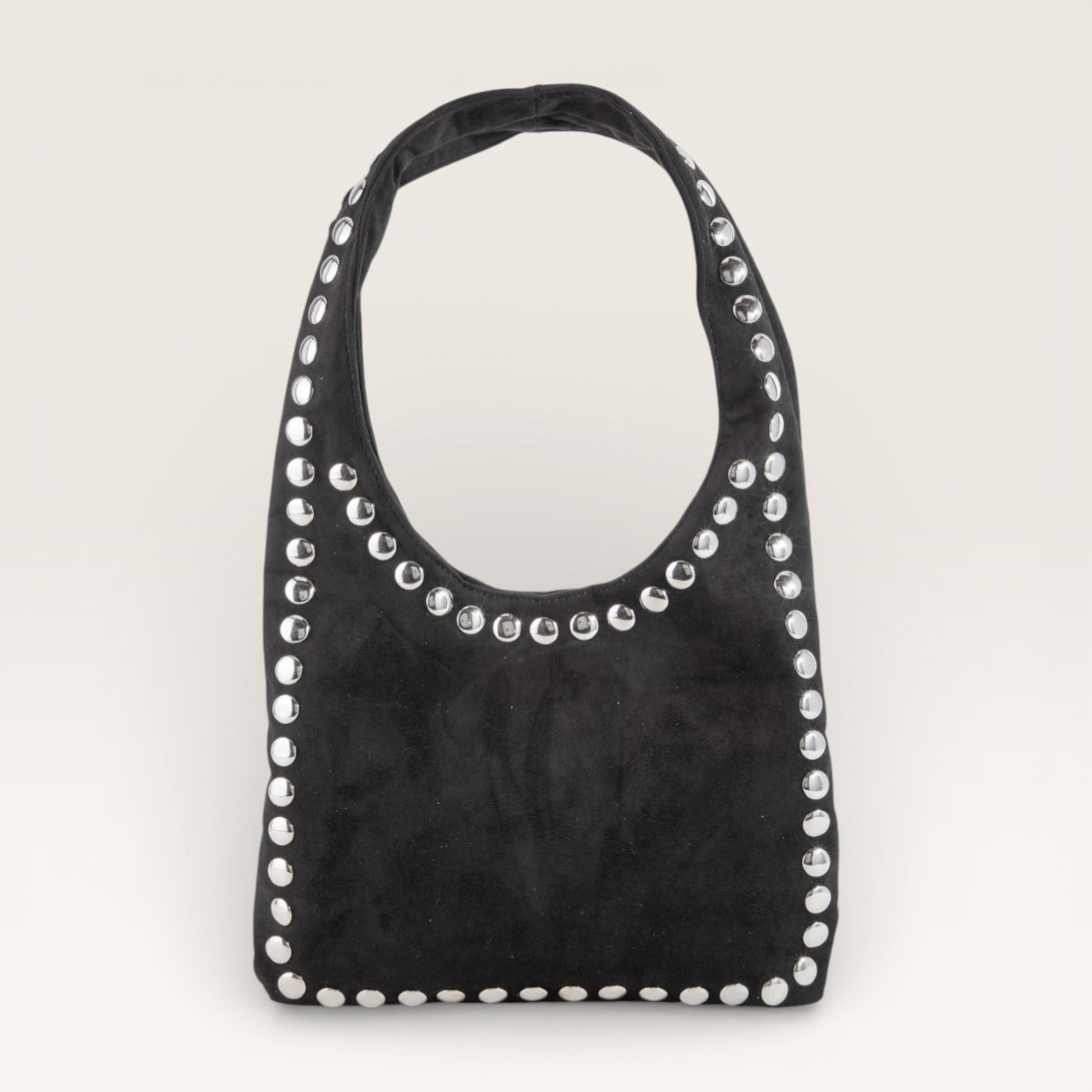 Black handbag with silver studs on a light gray background