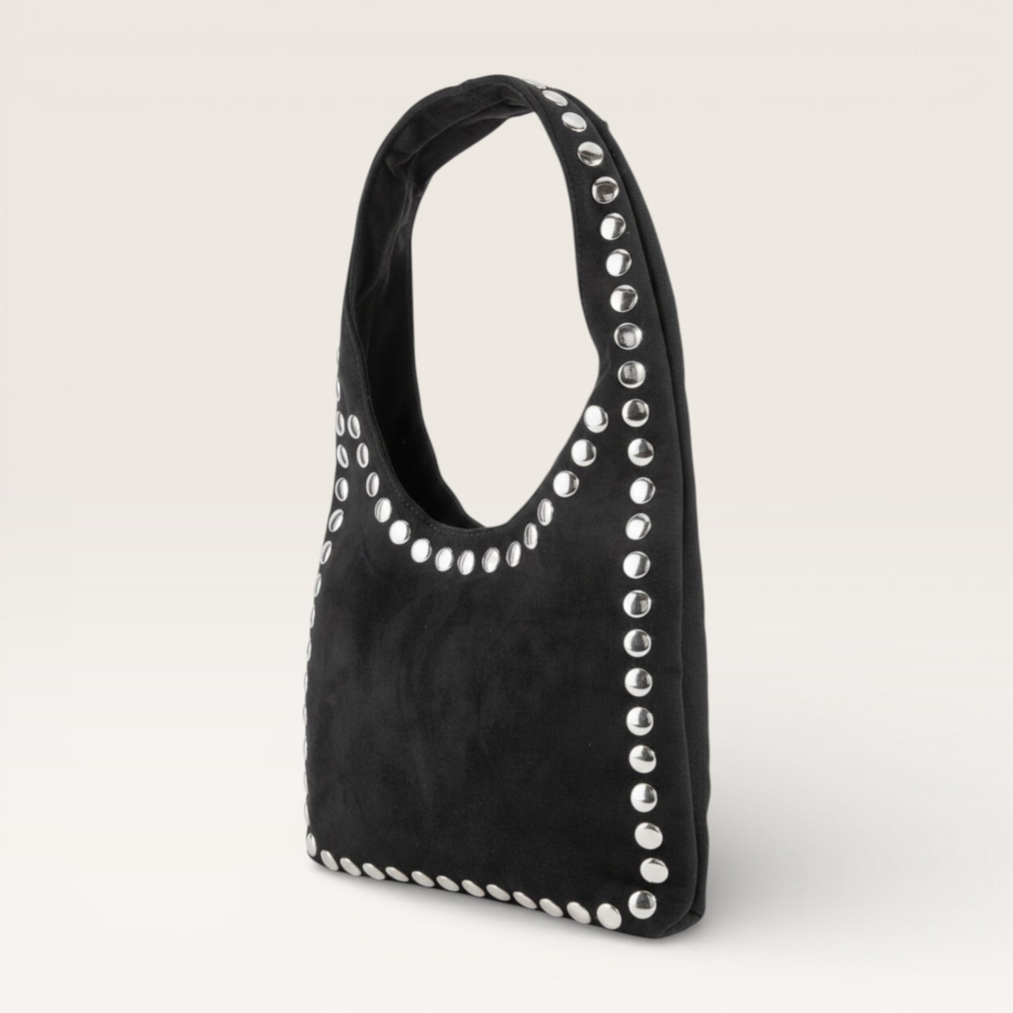 Black handbag with silver studs on a light gray background