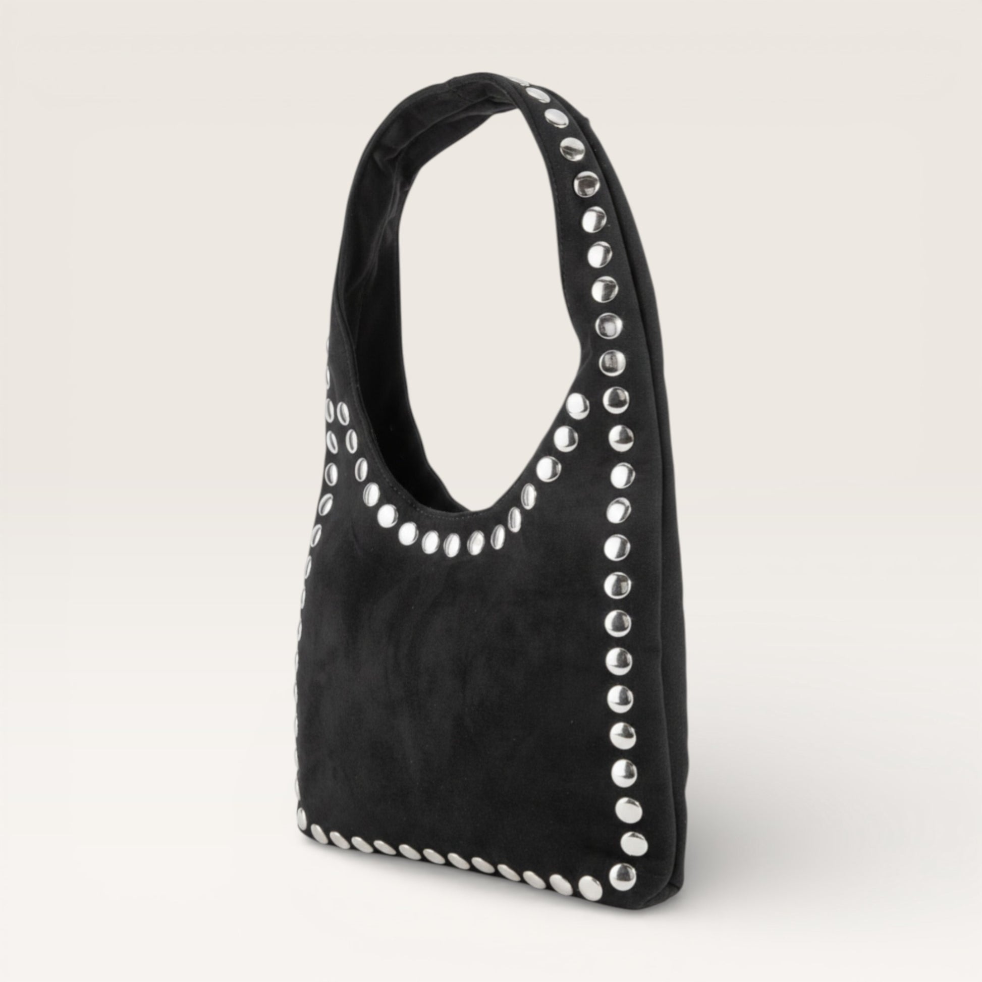 Black handbag with silver studs on a light gray background