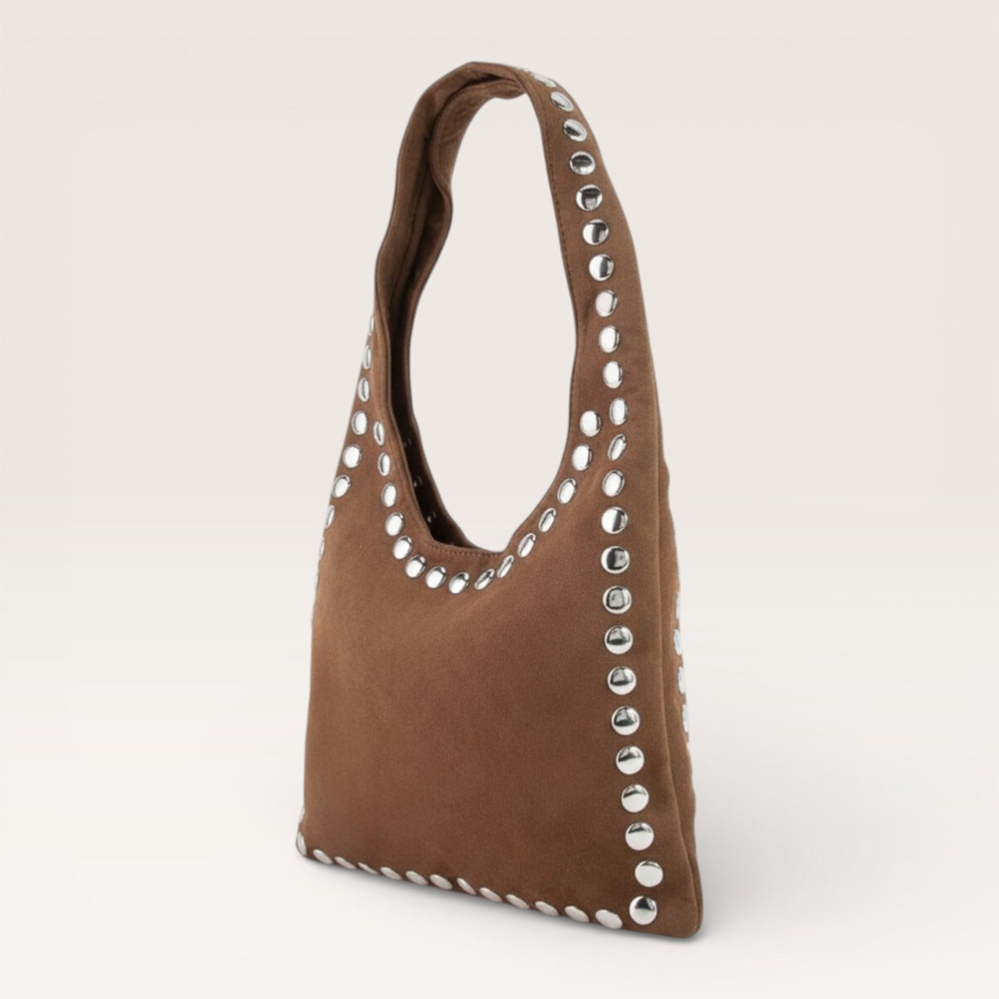 Brown handbag with silver studs on a light gray background