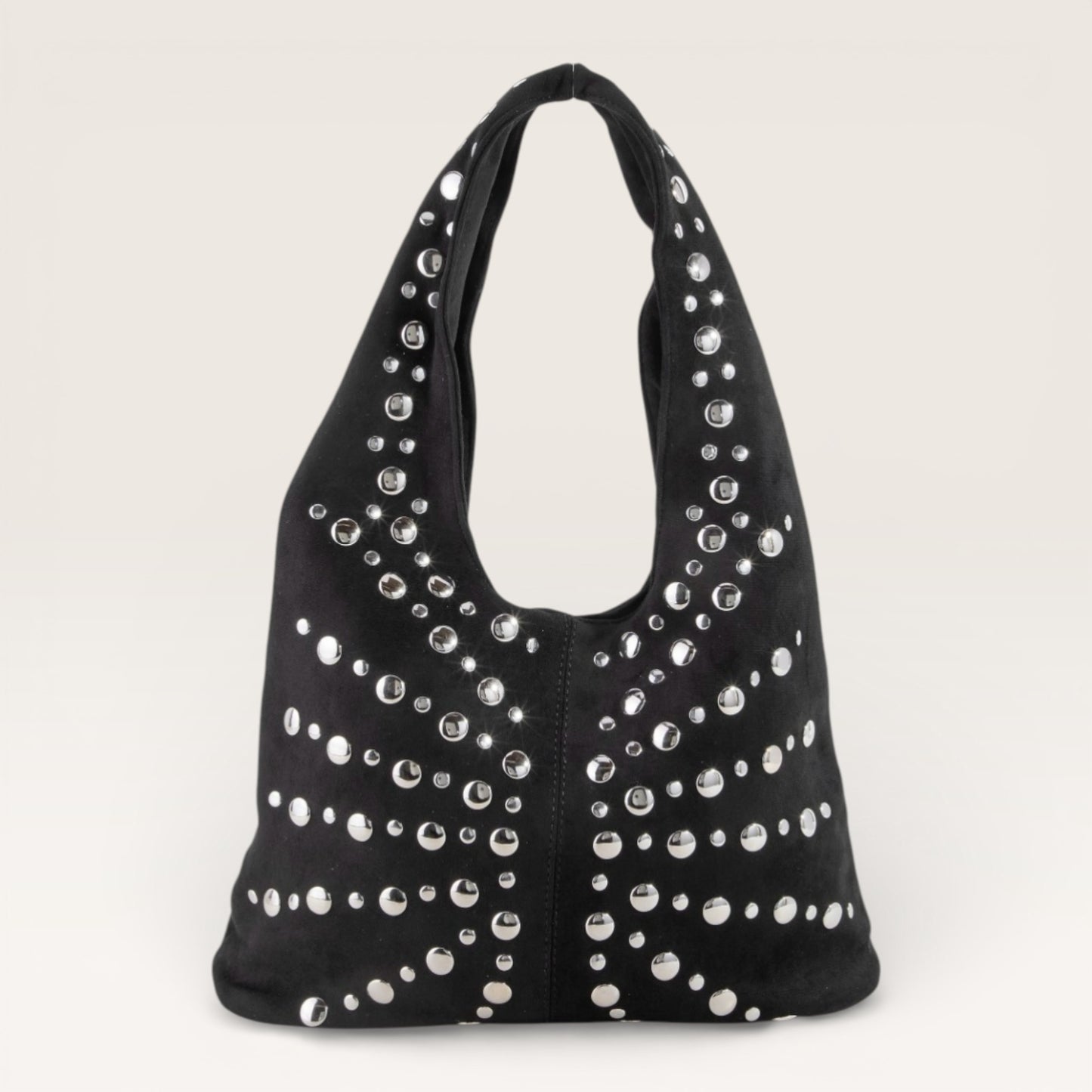 Black handbag with silver studs on a light gray background