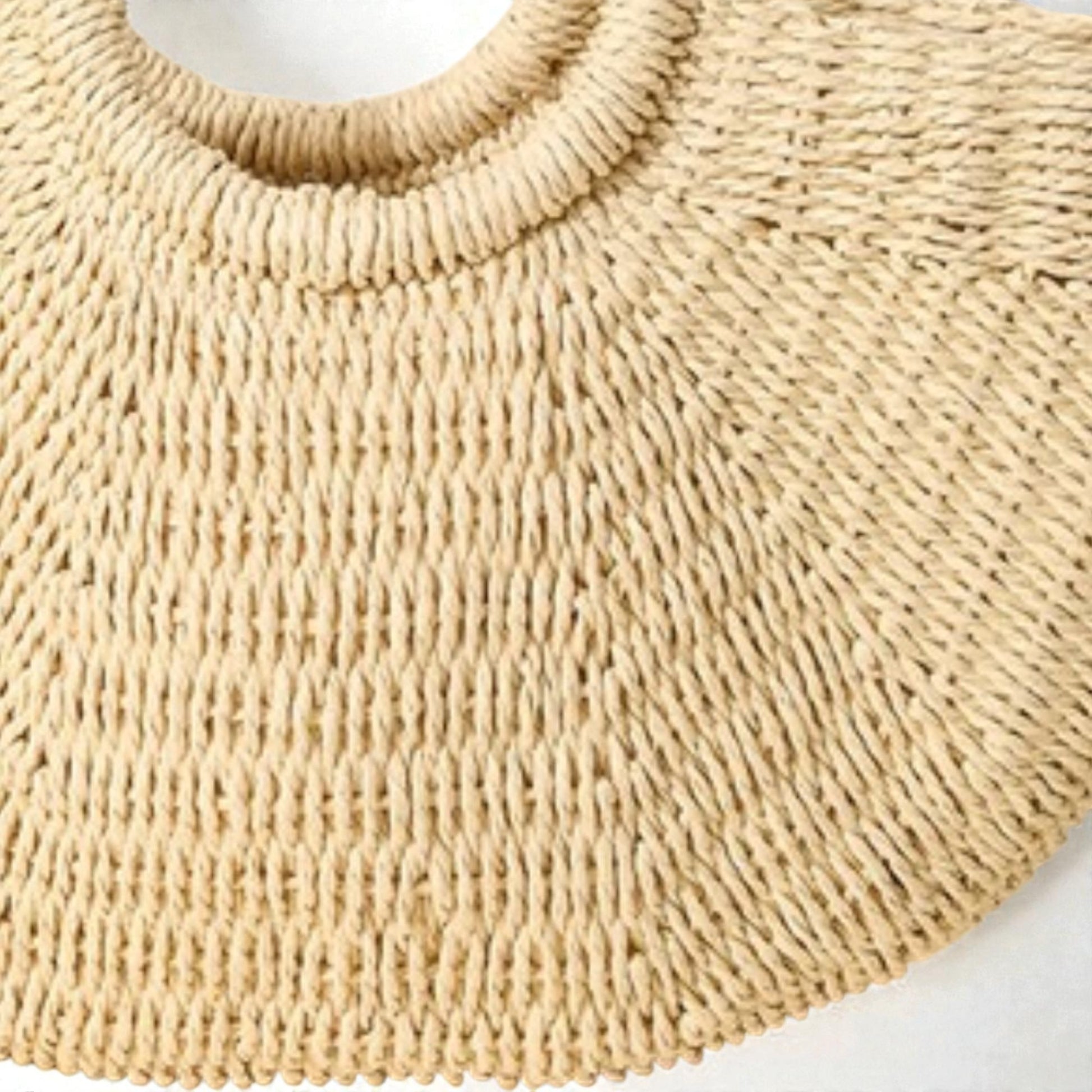 Close-up of a beige knitted collar on a white background