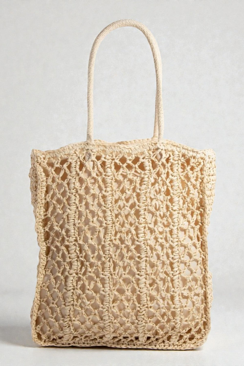 Beige woven tote bag on a light gray background