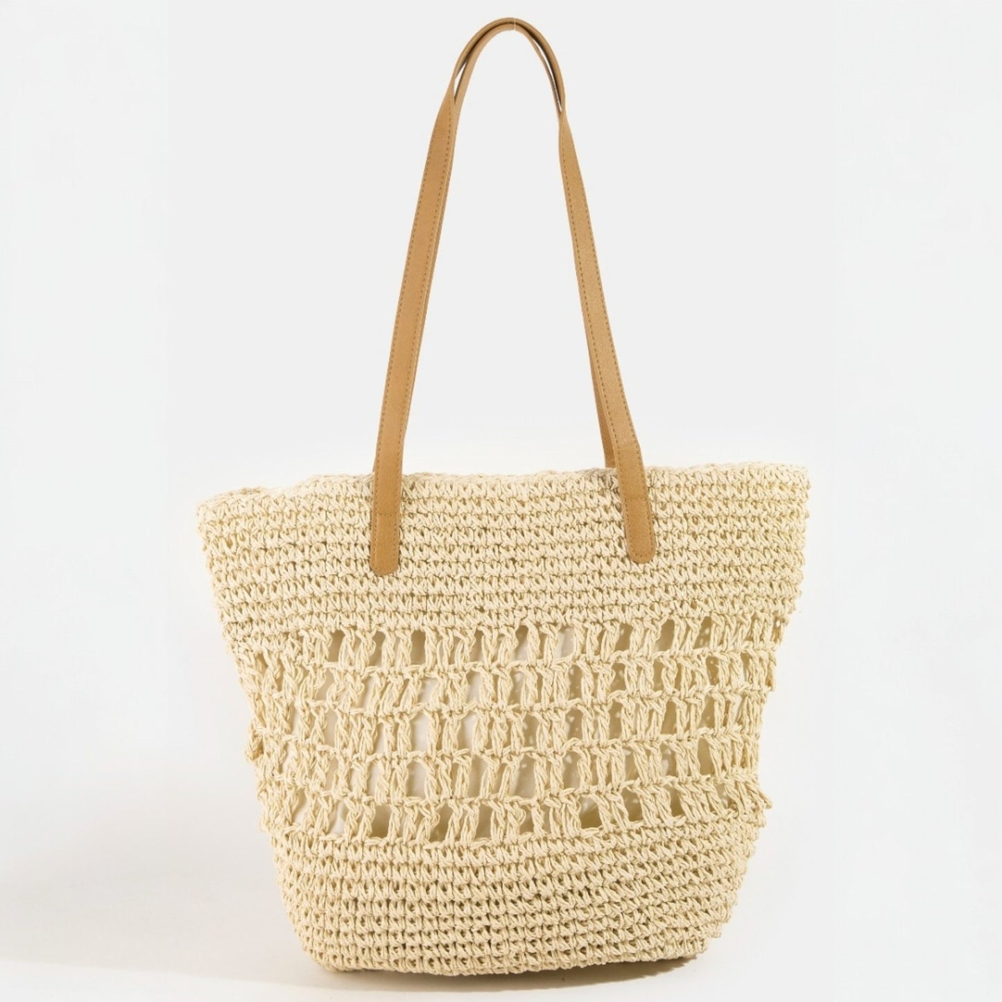Woven straw tote bag with tan handle on a white background