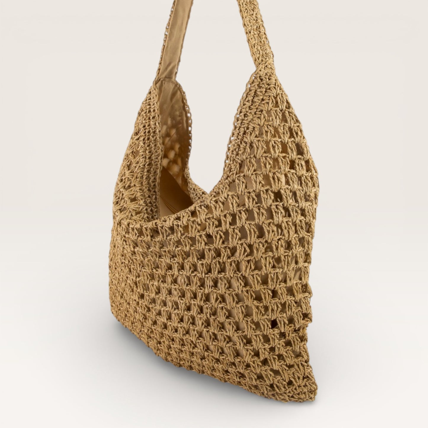 Brown woven handbag on a light beige background