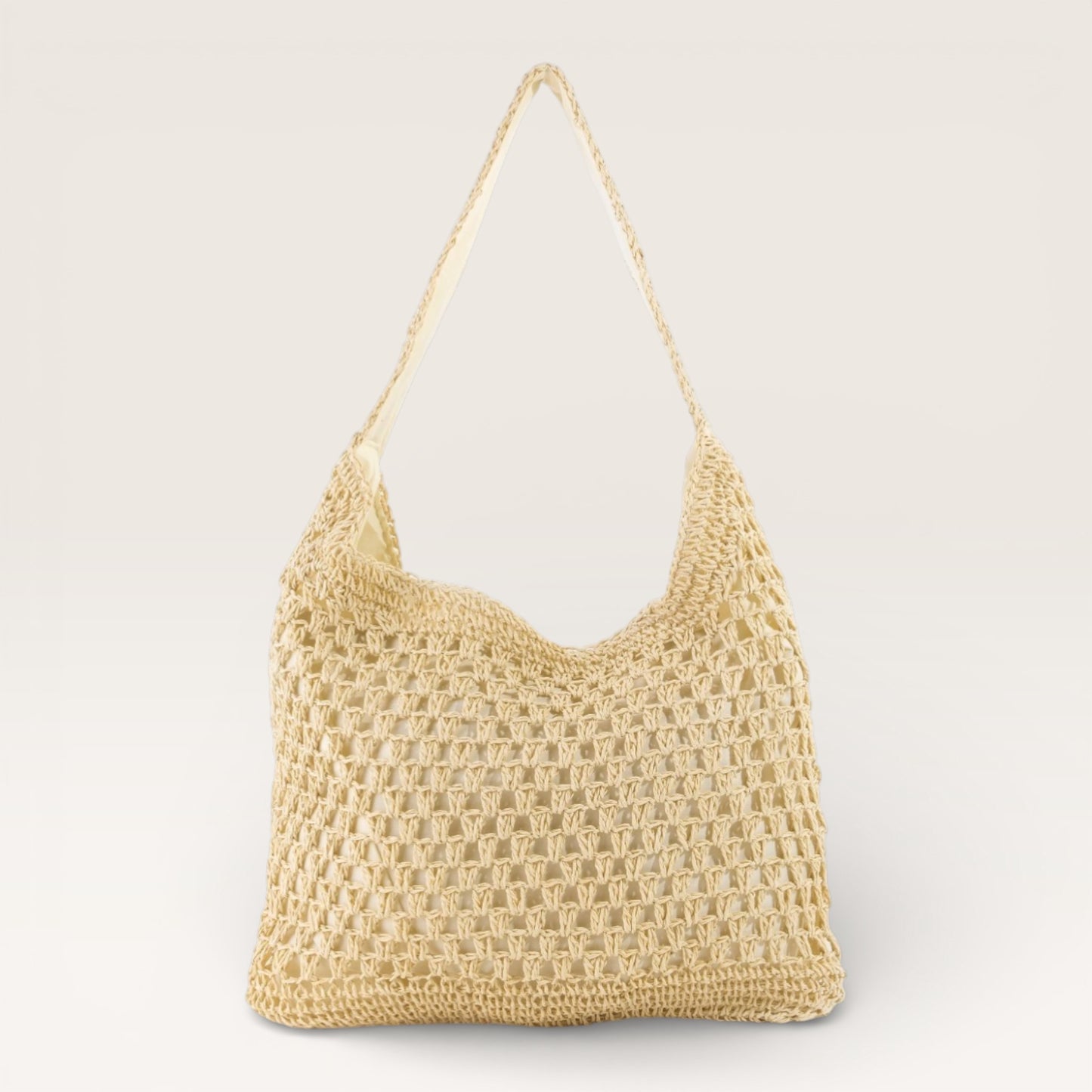 Beige woven handbag on a light gray background