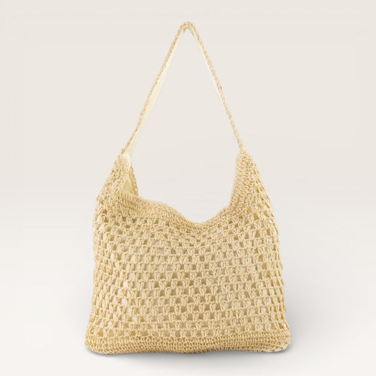 Beige woven handbag on a light gray background