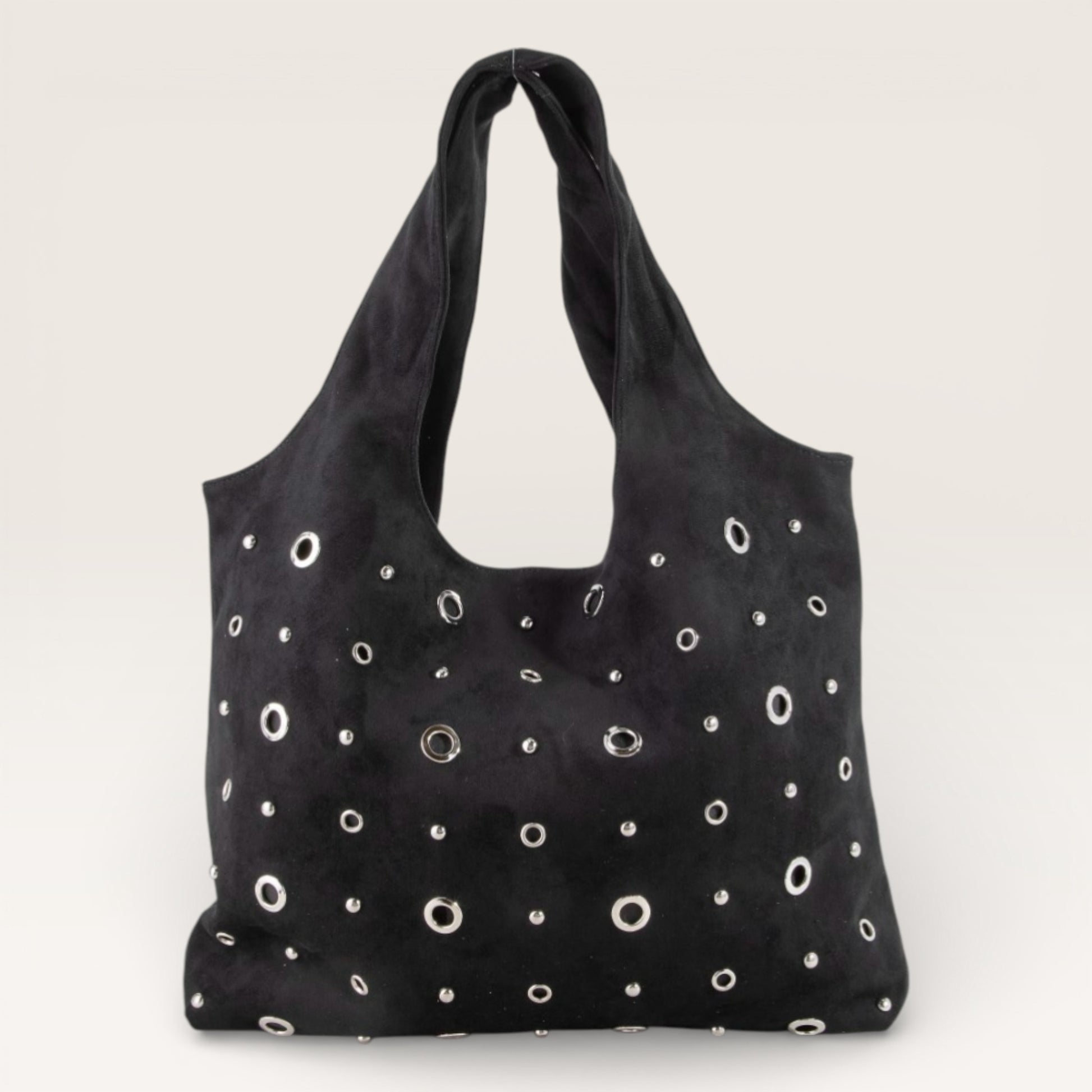 Black bag with white circular patterns on a light gray background