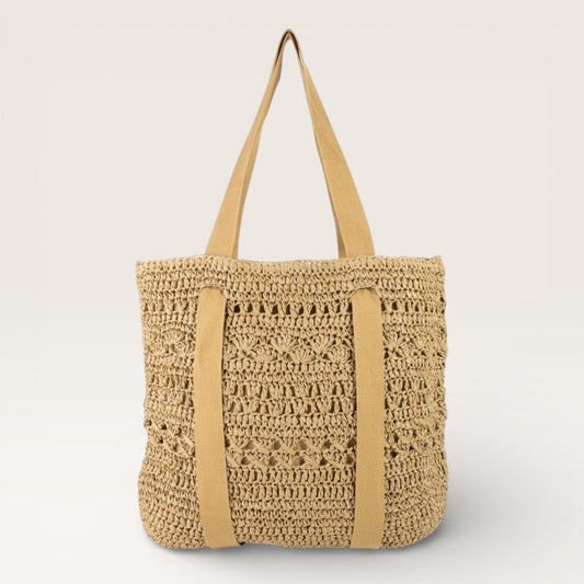 Beige woven tote bag with tan straps on a light gray background