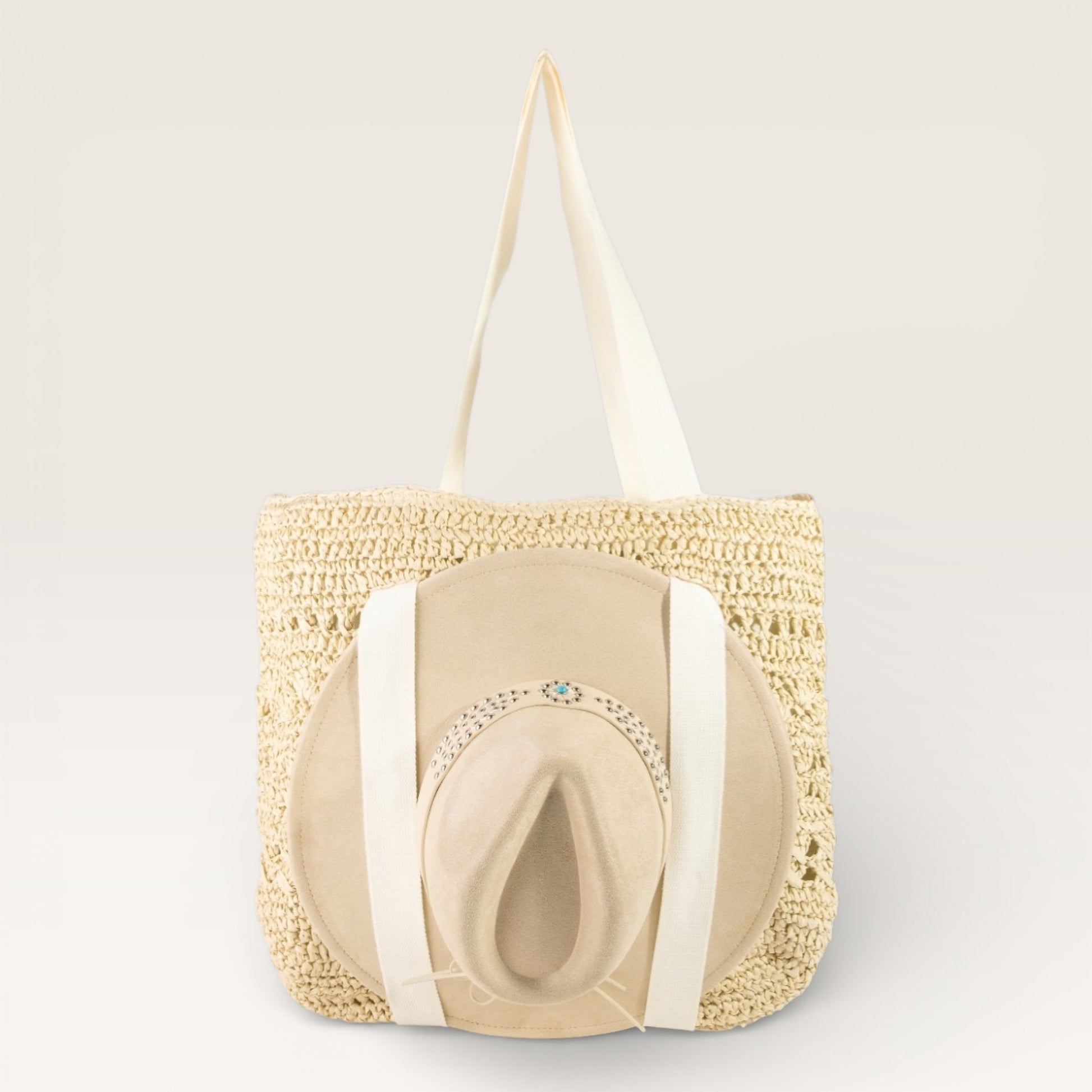 Beige straw bag with a matching hat on a light gray background