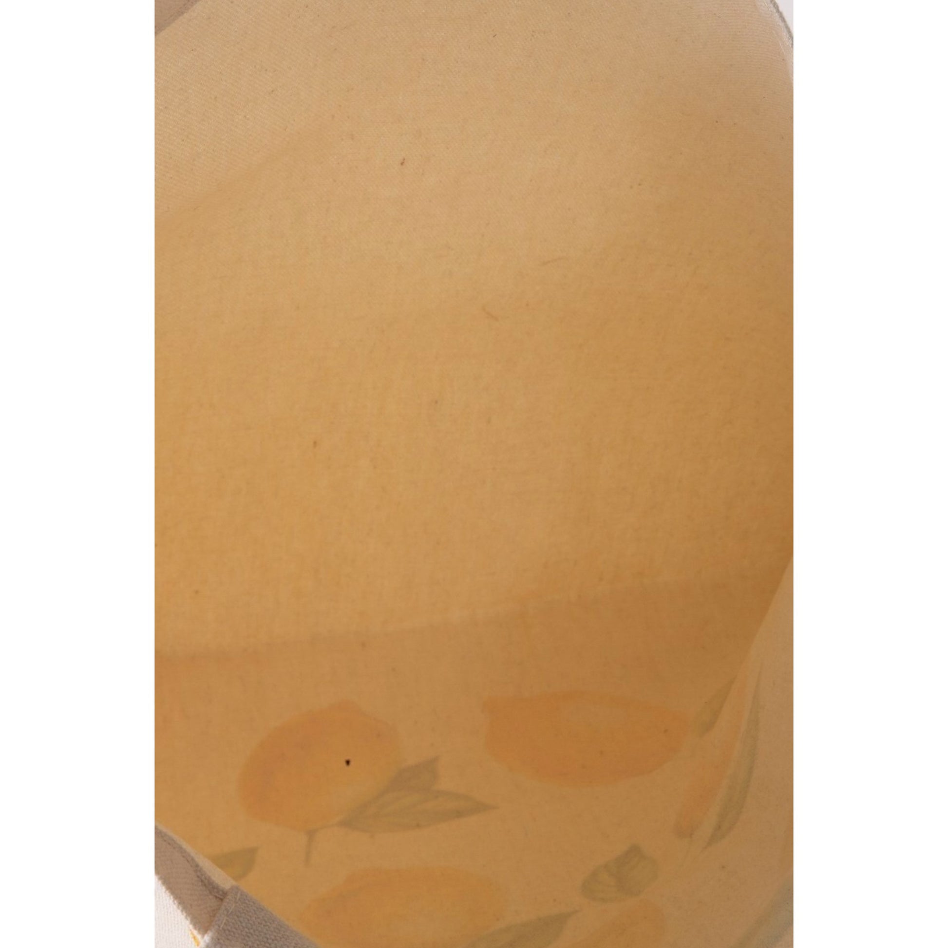 Close-up of a textured beige surface with floral patterns.