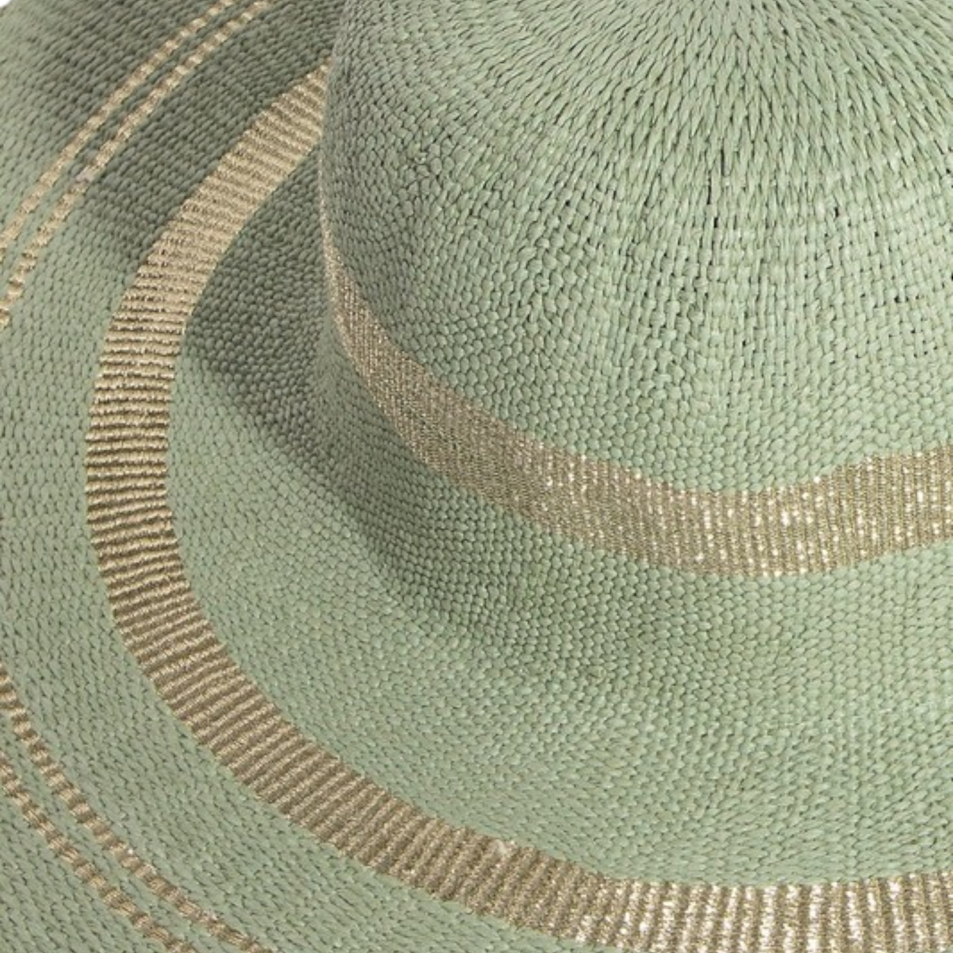 Close-up of a green fabric with gold embroidery