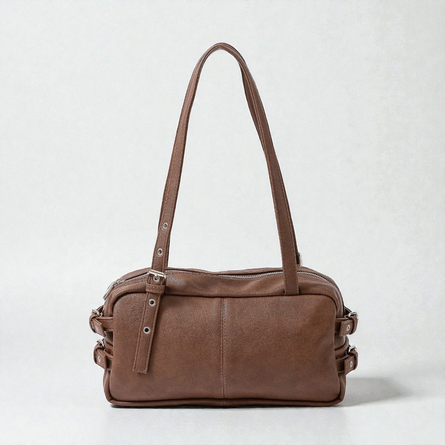 Brown leather handbag on a white background