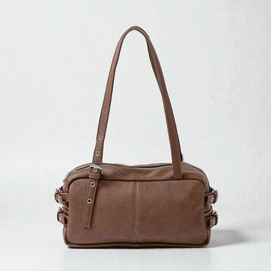 Brown leather handbag on a white background